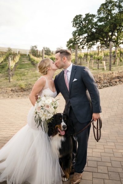 Bride and Groom with their dog at their wine country wedding.